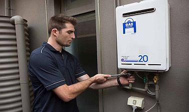 Fred, one of our Turlock water heater repair pros, is repairing a tankless unit